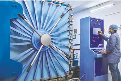 Operator at the control panel of a sterilisation chamber
